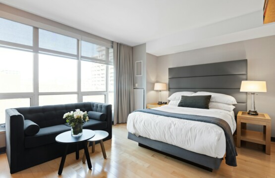 white bed linen on bed